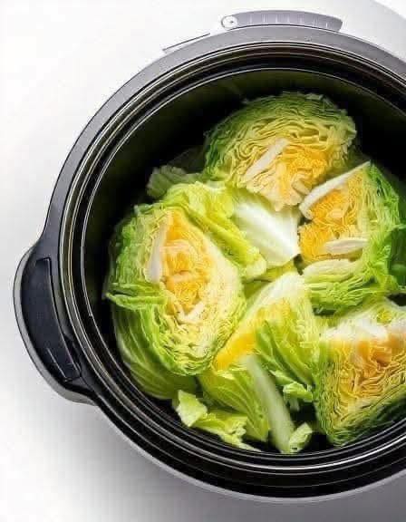 Put raw cabbage wedges in a slow cooker wit